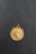 A Victorian shield back gold sovereign, shield back, young head and Sydney mint mark, in a removable