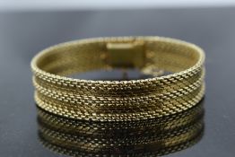 A 14ct gold woven cuff bracelet having concealed box clasp, approx 33.5g