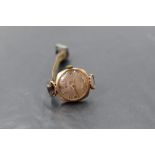 A lady's vintage 9ct gold wrist watch by Tissot having baton and Arabic numeral dial and leather