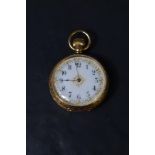 A small Edwardian 18ct gold top wound pocket watch by Waltham no:12978654 having Arabic numeral dial