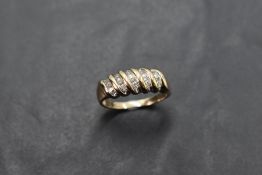 A 9ct gold moulded twist ring having diamond chip decoration, size P & approx 2.9g