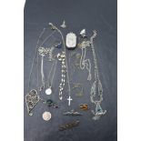A selection of white metal and HM silver jewellery including necklaces, pendants, brooches, charm