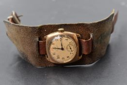 A 9ct gold wrist watch by Waltham having Arabic numeral dial with subsidiary seconds in gold case on