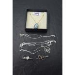 A small selection of silver jewellery including an enamelled egg pendant on a gold plated silver