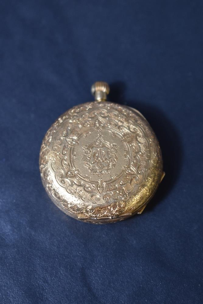 A small yellow metal top wound pocket watch stamped 18K having Roman numeral dial in extensively - Image 2 of 3