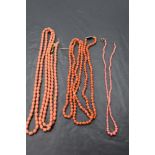 Three strings of carved coral beads of various lengths