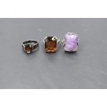 Three silver dress rings, two having oversized stones the other an oval stone, sizes N/O