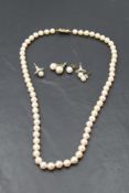 A string of cultured pearls of even form having 9ct gold clasp, approx 18' and 3 pairs of cultured