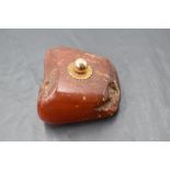 A rough cut amber paper weight having a rose gold knop, approx 137g