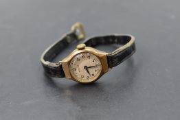A lady's 9ct gold wrist watch by Bernex having Arabic numeral dial in gold case on black leather