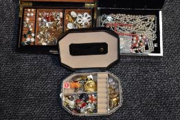 Three jewellery boxes containing a selection of costume jewellery including wrist watches, pearl