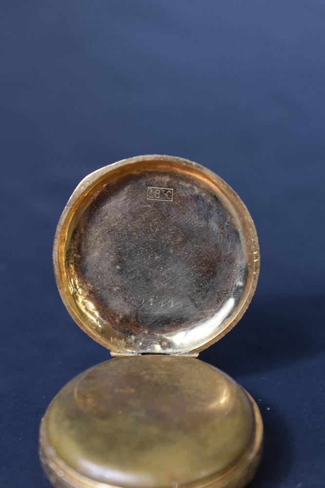 A small yellow metal top wound pocket watch stamped 18K having Roman numeral dial in extensively - Image 3 of 3