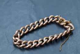 A rose gold curb link bracelet having concealed box clasp stamped 9ct, approx 17.1g