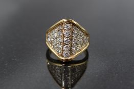 A multi set diamond ring having approximately 2ct of diamonds in a pave set ridged mount on a yellow