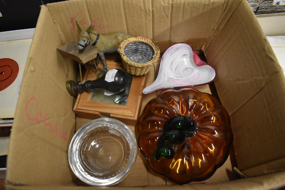 A selection of curios including an art glass pumpkin, a spelter donkey and a stamp head