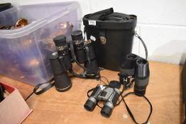 Three pairs of modern binoculars including Mark Scheffel 10-30x50 Zoom all having cases