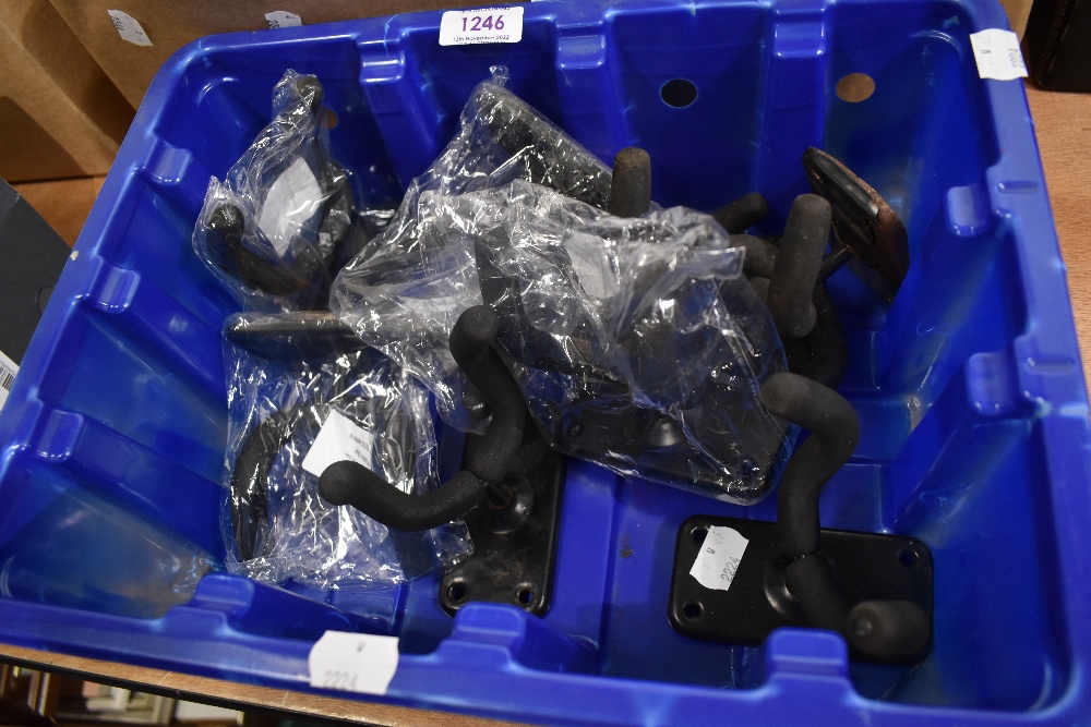 A box containing nine wall mounted guitar hangers.