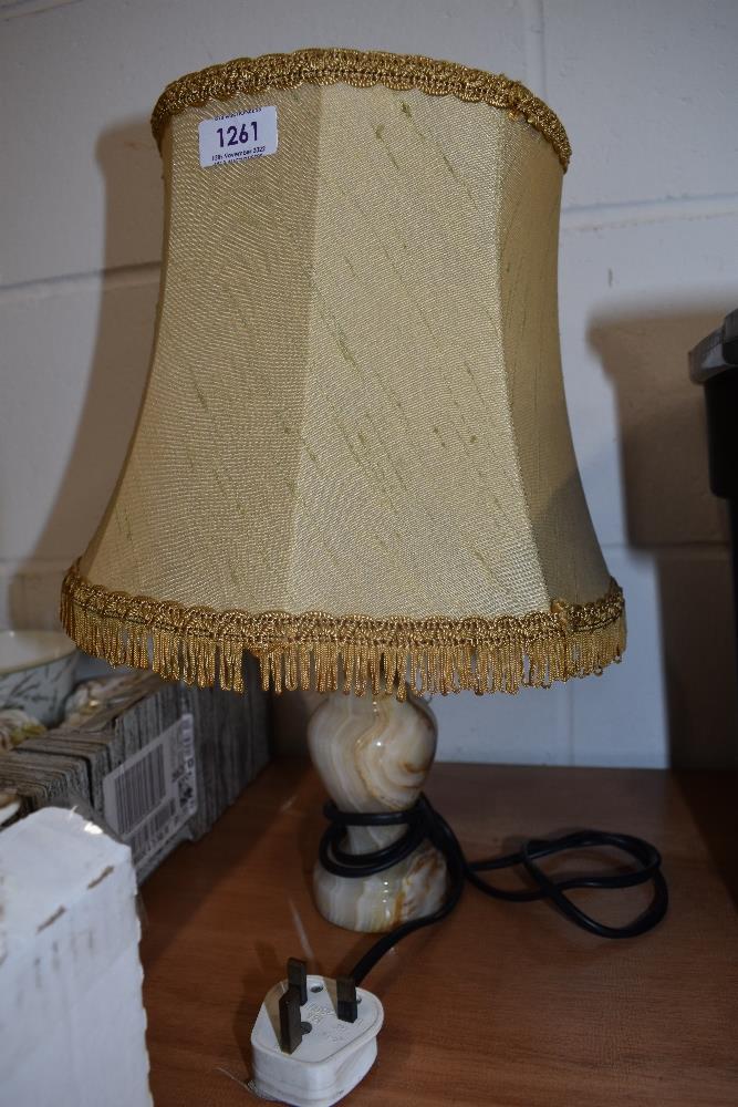 A vintage table top lamp having Onyx stone turned base with original shade