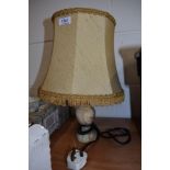 A vintage table top lamp having Onyx stone turned base with original shade