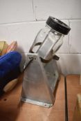 A 20th century kitchen counter top aluminium and glass jar butter churn