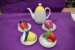 An Adderley 'Fiesta' pattern part coffee set, two cups cracked, two saucers missing