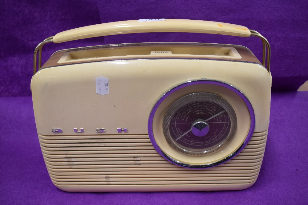 A mid century Bush radio in a cream and tan colour