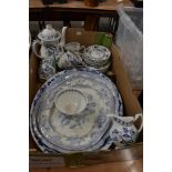 A collection of blue and white ware including part tea set and meat chargers.