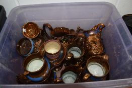 Two boxes of assorted Lustre Ware including jugs and teapots.