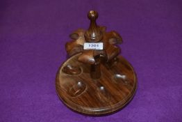 A 20th century mahogany pipe smokers rack or stand