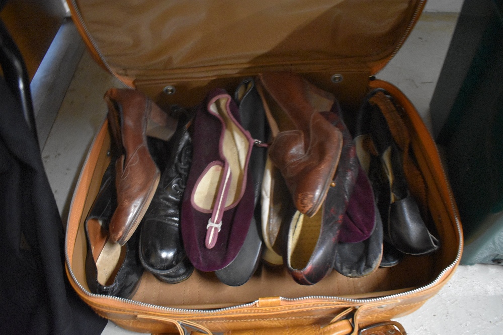 A suitcase containing a mixed lot of mens and womens vintage shoes.AF.