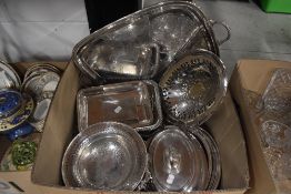 A selection of vintage silver plated serving wares including lidded dishes, fruit basket and