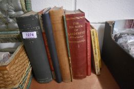 A selection of library books including the big book of gardening and Equine within