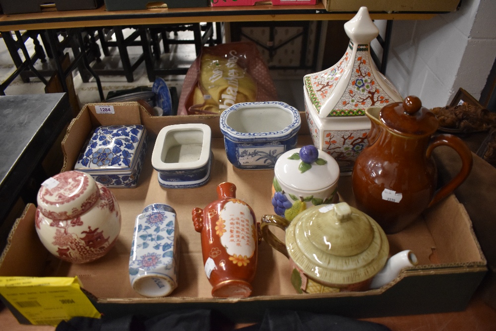 A mixed box of ceramics, including teapot and trinket boxes.