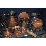 A fine selection of Victorian copper kitchen wares including a graduated set of six water jugs,
