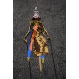 A vintage Indonesian Wayang Golek rod puppet or marionette