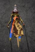 A vintage Indonesian Wayang Golek rod puppet or marionette