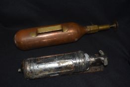 Two early 20th century fire extinguishers including a copper and brass model and a Pyrene example