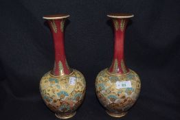 A pair of early 20th century Royal Doulton vases having textured lace effect finish to body,