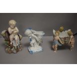 Three antique German porcelain cherub design pieces including table centre, spoon warmer and a vase