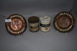 Two early 20th century Players cigarettes advertising ashtrays in copper with two associated tins