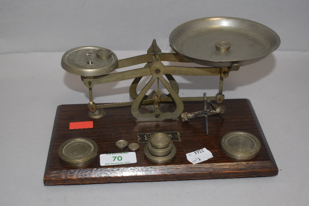 A set of vintage Ensign postal scales with accompanying weight set