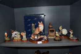 A selection of Border Fine Arts and similar figurines including Blue Tit and Hydrangea, and