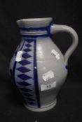 An early 20th century vintage Mettlach style water jug