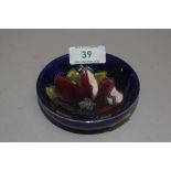 A 20th century Moorcroft pottery pin dish with deep blue glaze and Anemone design