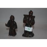 Two antique Japanese Okimono box wood figures one having had repair to head.