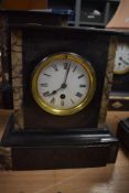 An Victorian slate and marble insert mantel clock with French movement, missing one insert