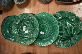 Six Victorian green glaze cabbage form plates including Copeland, one or two having minor chips