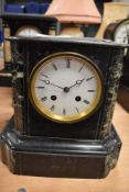A Victorian slate mantel clock having marble inserts and enamel dial damage to one corner