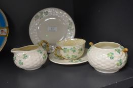 A selection of modern Irish Belleek ceramics including a tea cup and saucer set, sugar bowl, creamer