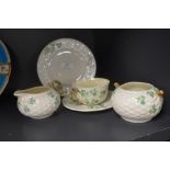 A selection of modern Irish Belleek ceramics including a tea cup and saucer set, sugar bowl, creamer
